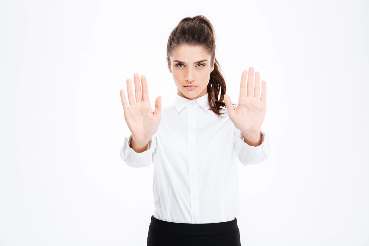 graphicstock-serious-beautiful-young-businesswoman-showing-stop-gesture-with-both-hands_S_x1c0GH2e_zc6xqy